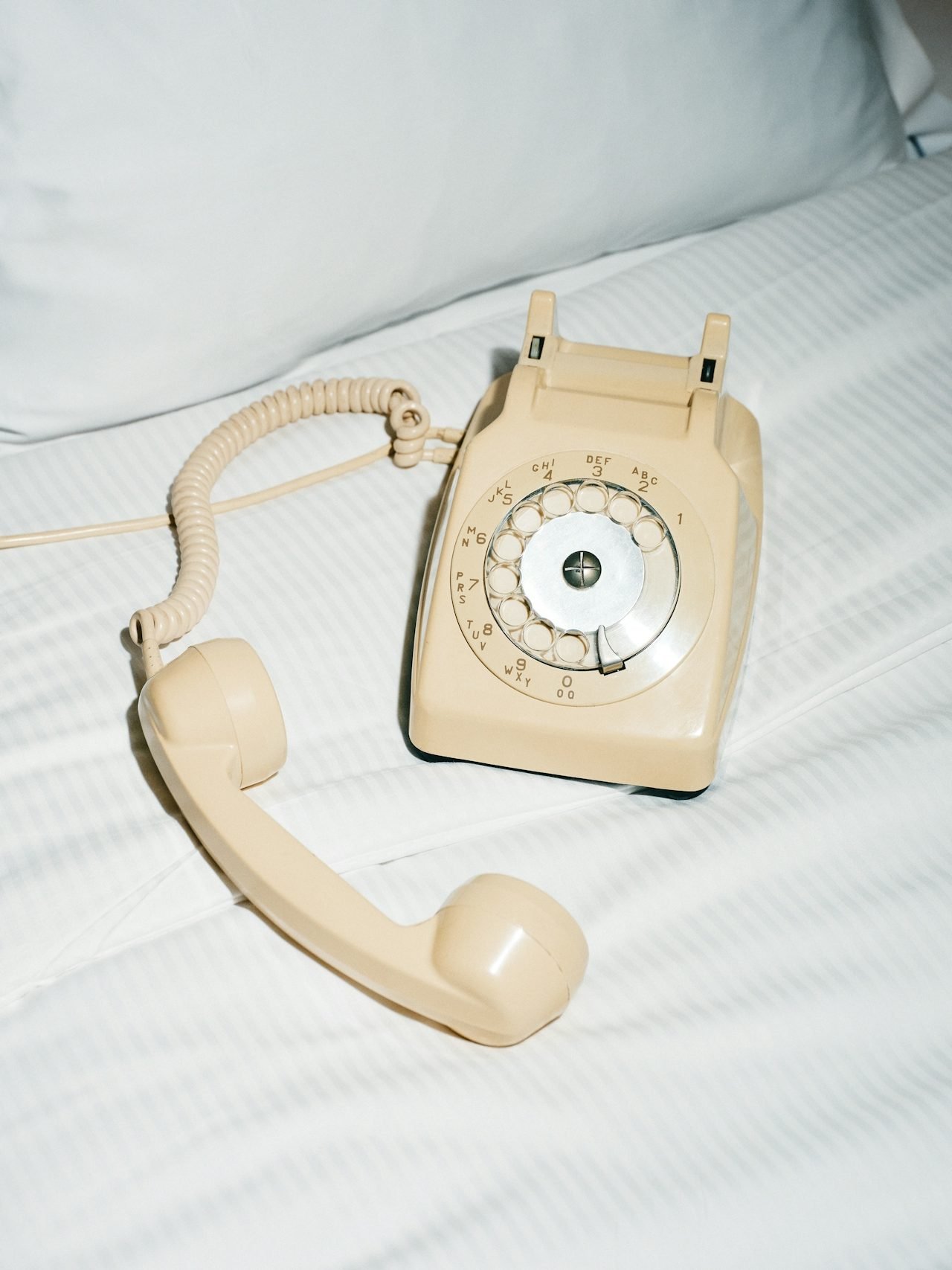 A phone left on the bed, the inquiry sitting there